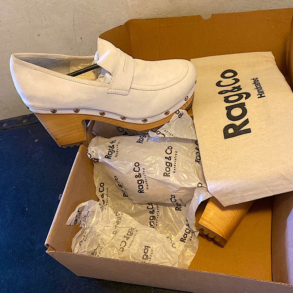 Brand new never worn. Pale off white color. No marks, scratches or stains.